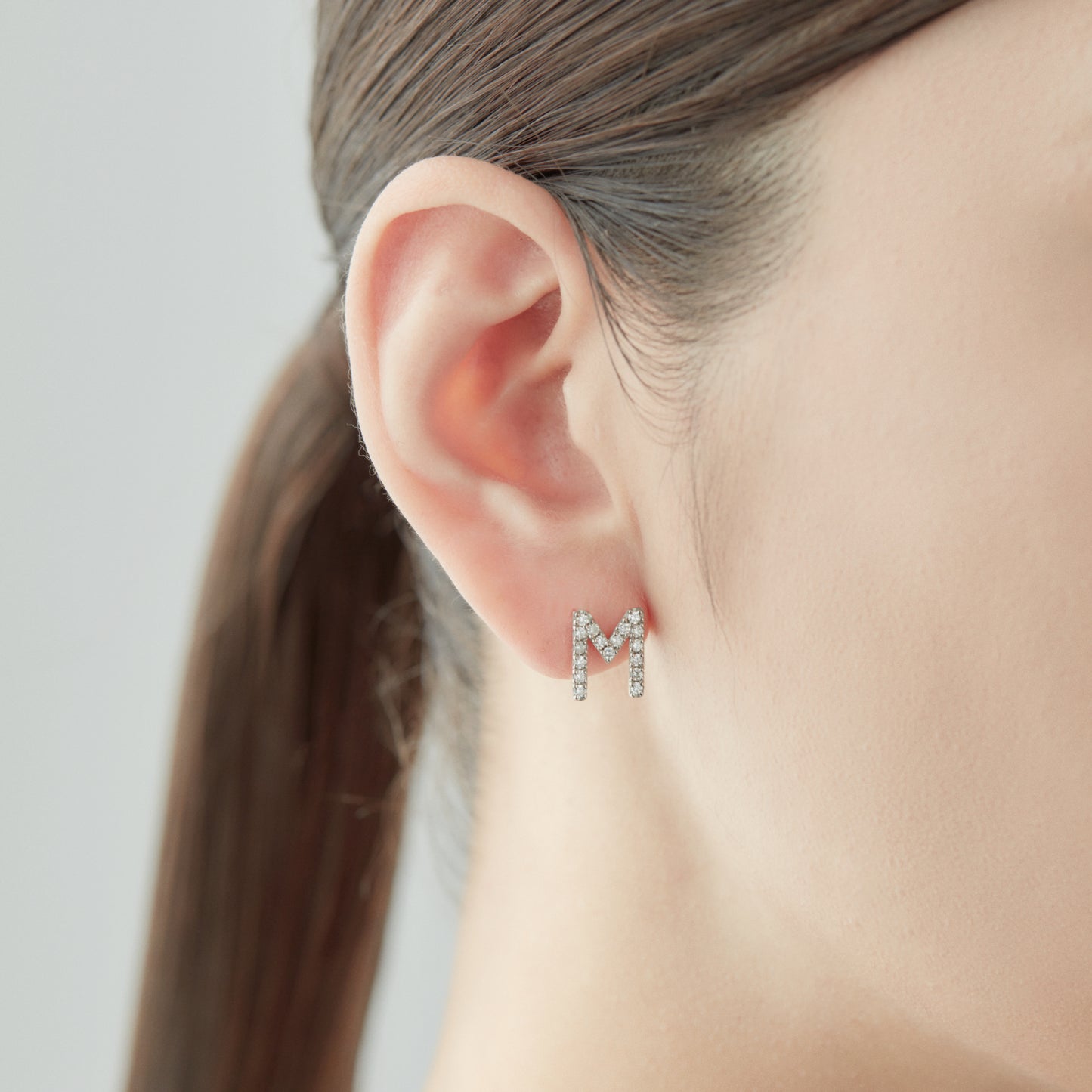 Symbol Pierced earring "M"